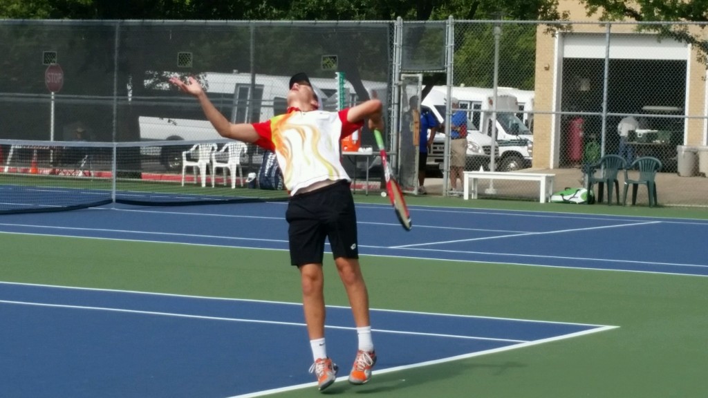 Thomas competes in tennis.