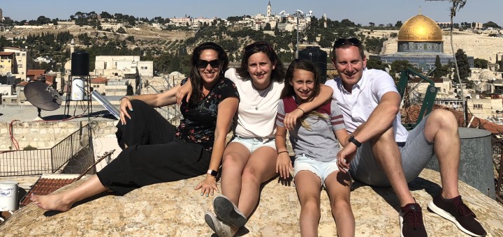 Julie, her daughters and husband Ed on a rooftop in Jerusalem