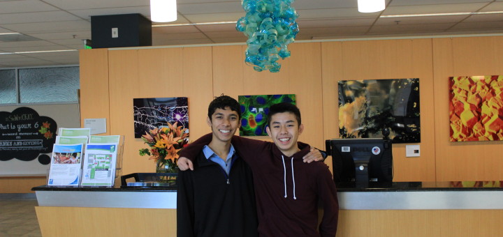 Gunn High School students Keshav Nand and Jerry Liu in front of their Idea Challenge creation.
