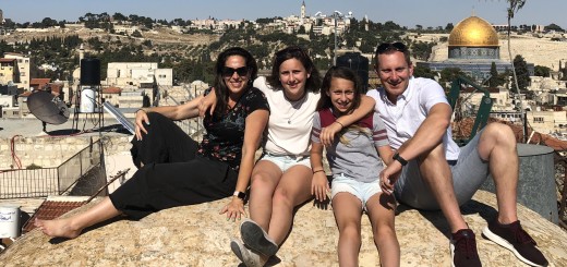 Julie, her daughters and husband Ed on a rooftop in Jerusalem